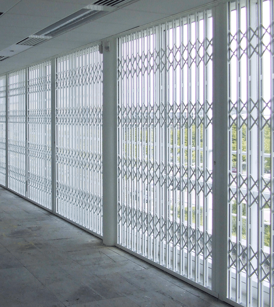 large steel security grilles covering full length windows
