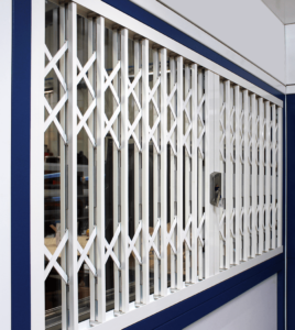 White steel security grilles covering window.