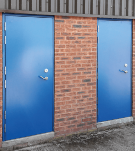 two blue steel security doors in building