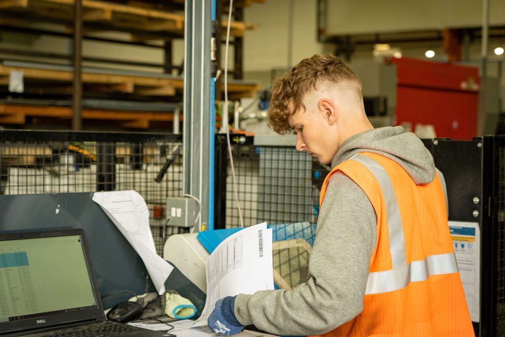 sorting paperwork in the factory