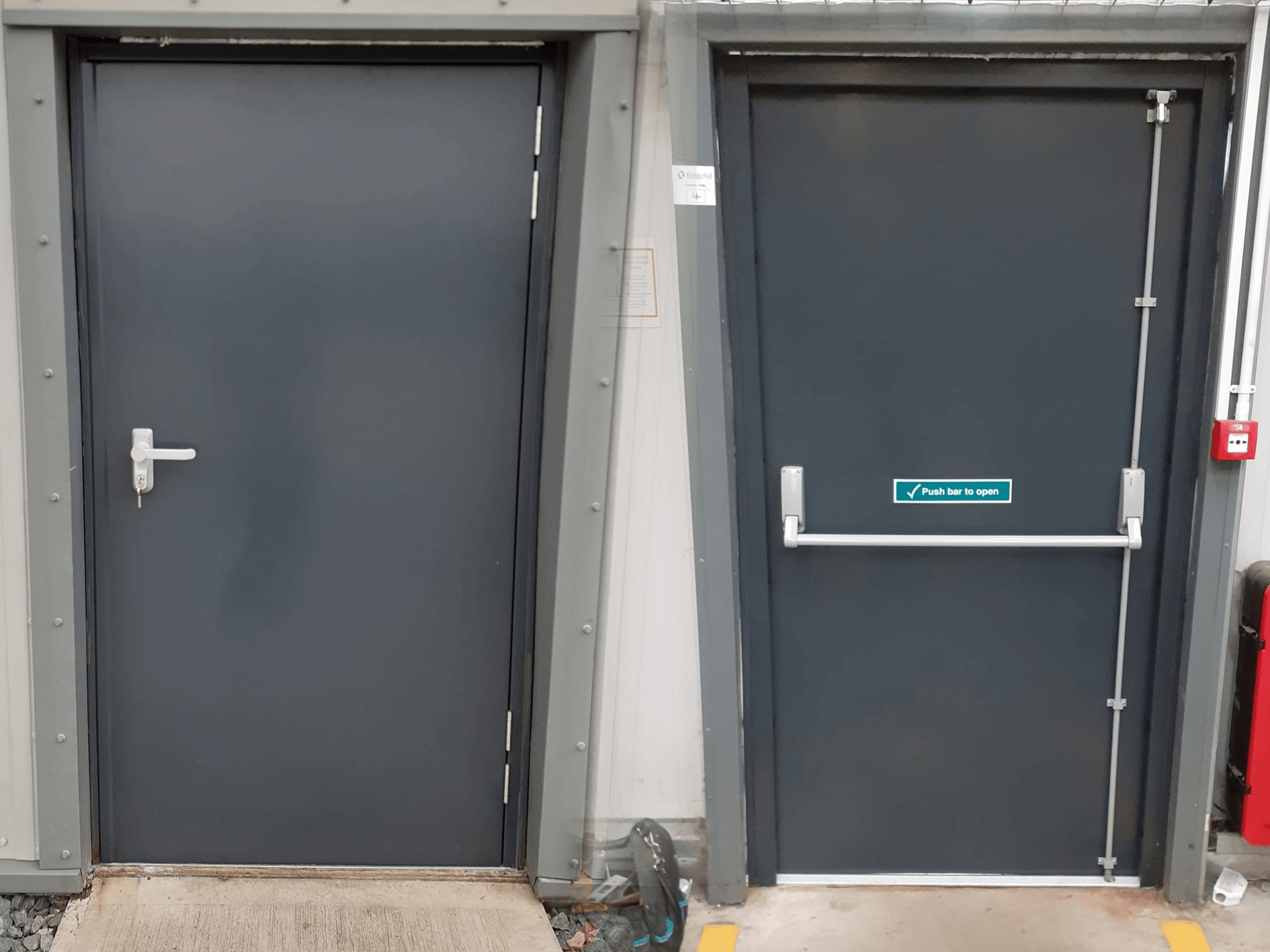grey steel door with fire escape