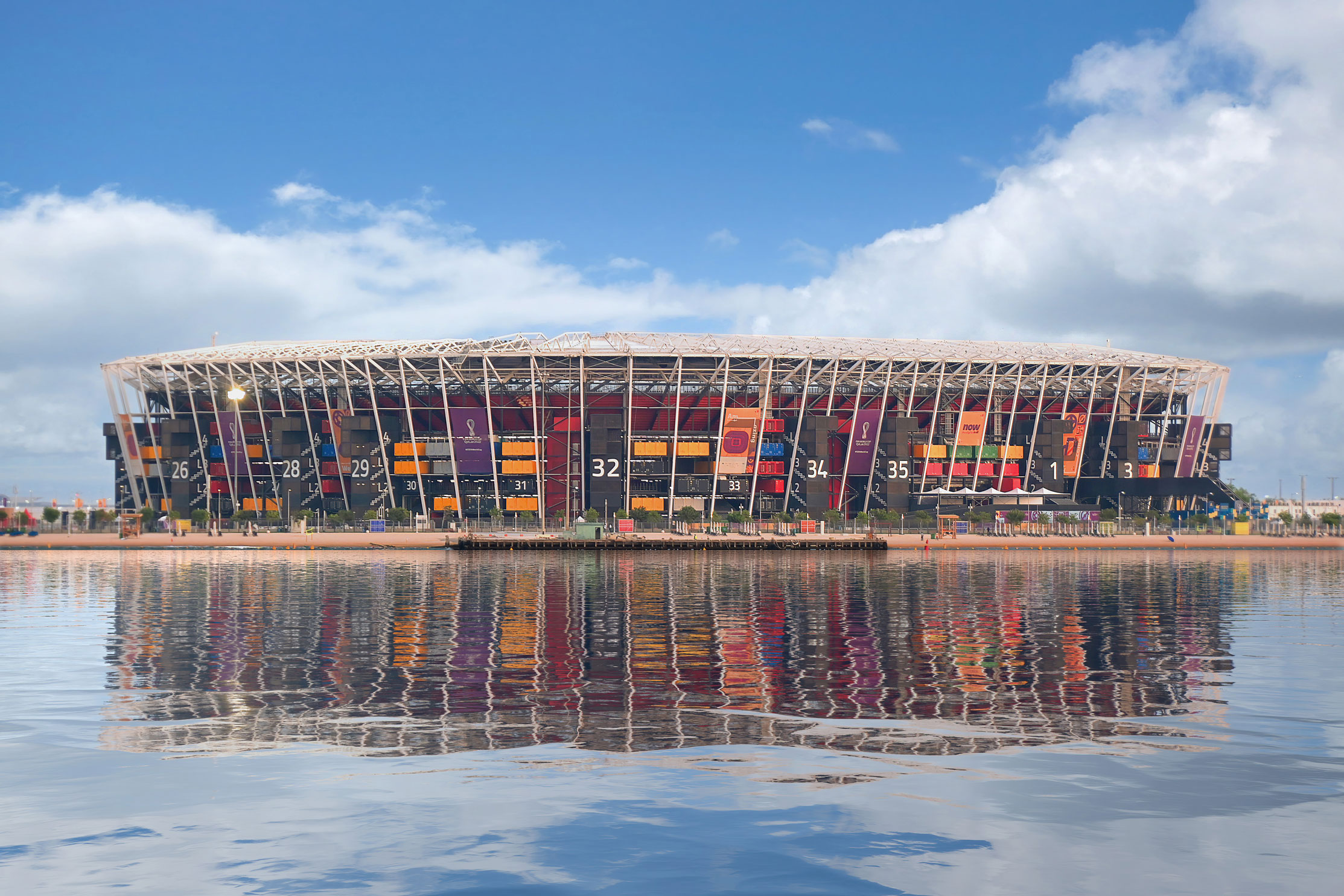 Qatar World Cup stadium next to a reflective river.